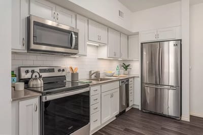 Modern kitchen with appliances in a senior living unit