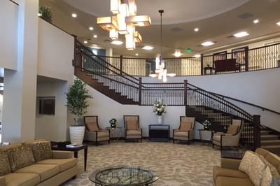 Lobby area with comfortable seating and decorative lighting