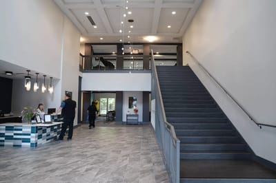 Interior lobby area with staff and residents