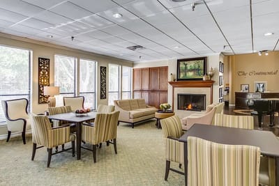 Bright common area with seating and fireplace