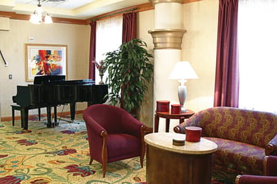 Interior lounge area with a piano and seating