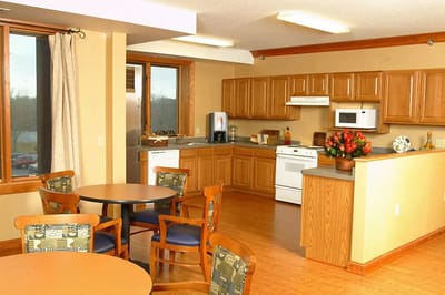 Bright common area with kitchen and dining space