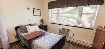 Cozy resident room with a bed and window