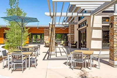 Outdoor patio with tables and shaded areas