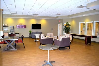 Bright common area with seating and tables