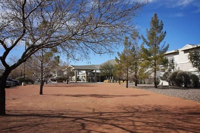 Exterior view of a senior living facility with trees