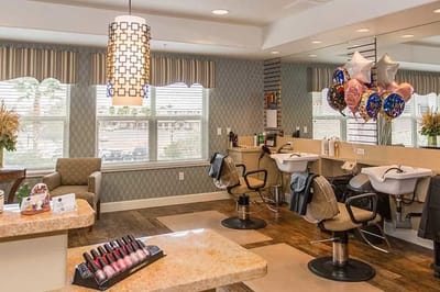Bright salon area with stylish decor and balloons