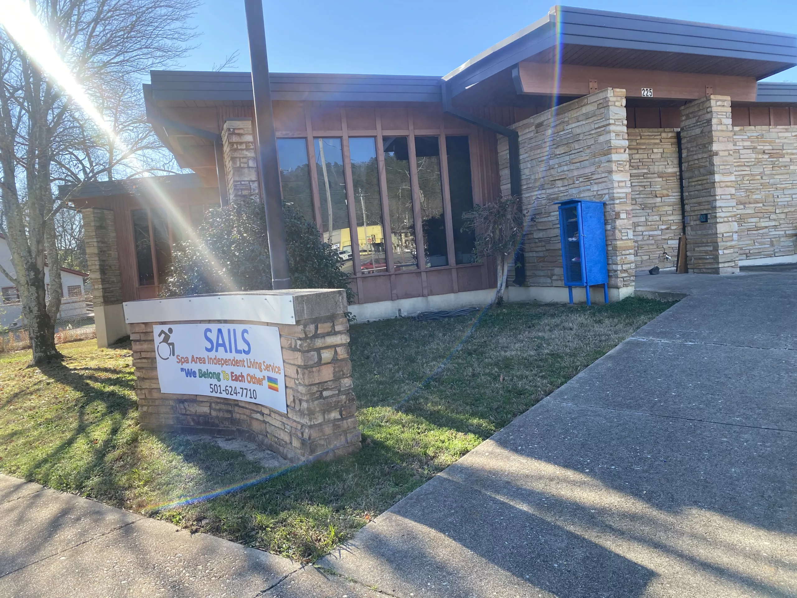 Exterior view of SAILS assisted living facility with signage