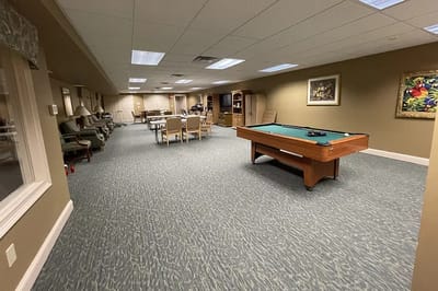 Common area with pool table and chairs