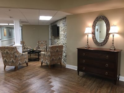 Interior common area with seating and decorative lighting