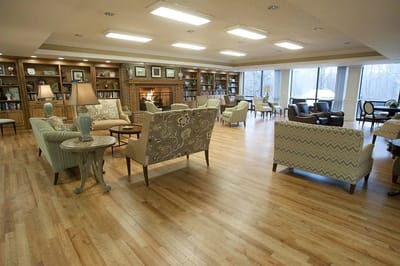 Interior common area with comfortable seating and bookshelves