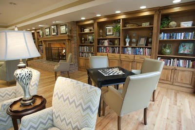 Cozy common area with a fireplace and bookshelf