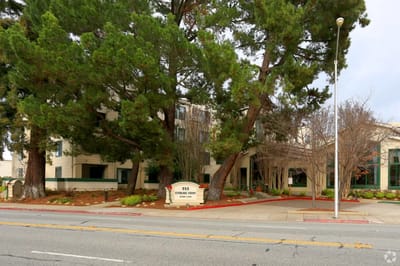 The exterior of Sterling Court with trees and landscaping