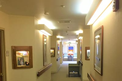 Hallway with framed photos in a resident area