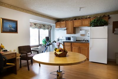 Interior view of a private resident room with kitchen