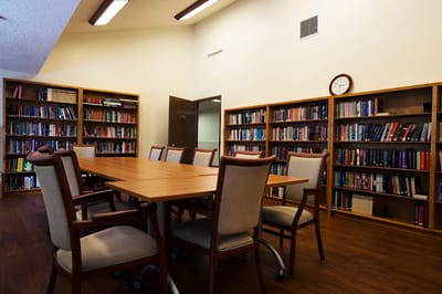 Interior view of a library with wooden shelves