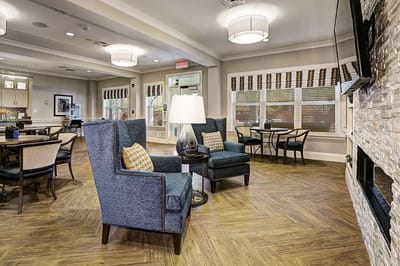 Bright common area with seating and tables