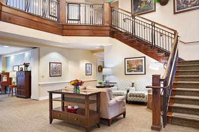 Common area with a staircase and seating