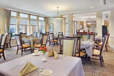 Dining room with neatly set tables and lighting
