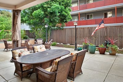 Outdoor patio area with seating and plants