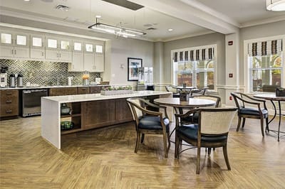 Interior common area with dining tables and kitchenette