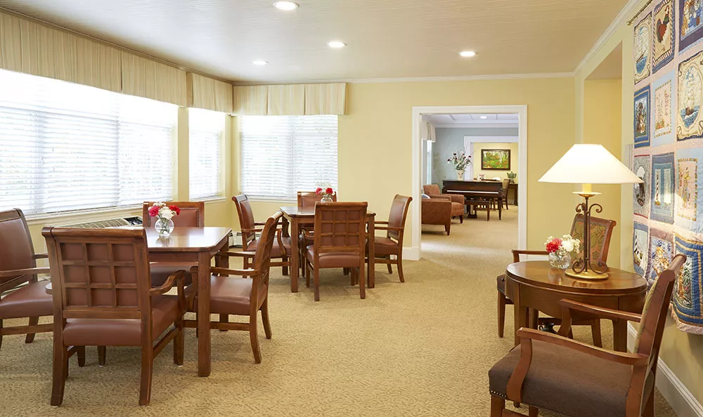 Bright common area with chairs and tables