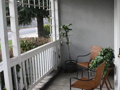 Cozy outdoor seating area with plants
