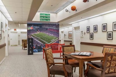 Activity room with sports-themed decor and seating
