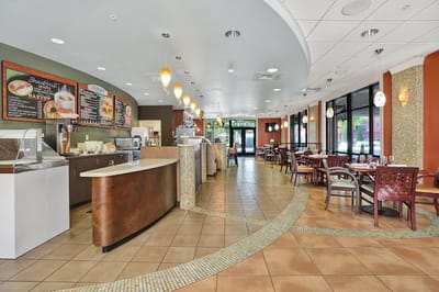 Interior view of a dining area with tables and chairs