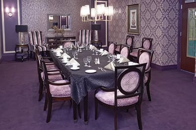 Elegant dining room setup with purple decor