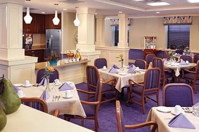 Dining room with tables set for a meal.
