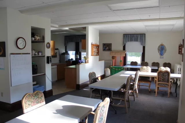 Bright common area with tables and chairs in a senior facility
