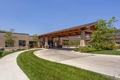 Entrance of a senior living facility with a covered driveway