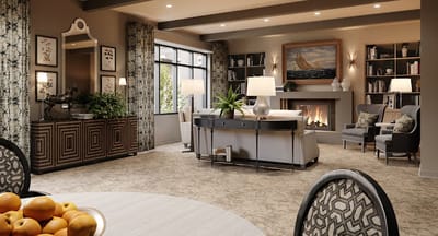 Bright common area with seating and a fire place