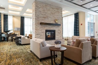 Interior view of a cozy lounge area with a fireplace