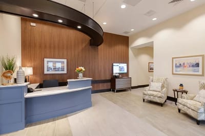 Bright interior lobby area with reception desk and seating