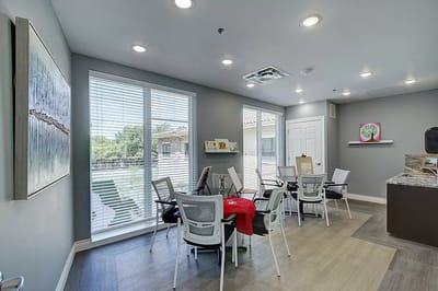 Bright common area with tables and chairs
