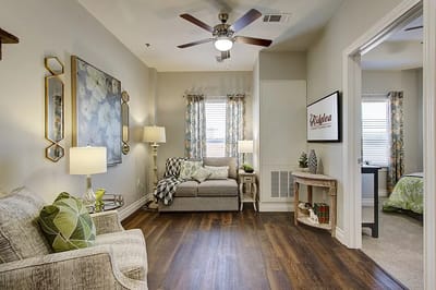 Brightly decorated resident room with cozy furnishings