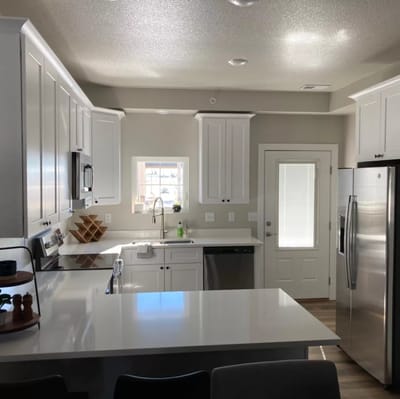 Modern kitchen interior with white cabinets