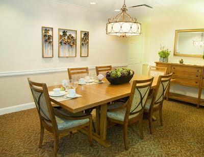 Bright dining room with wooden table and floral decor