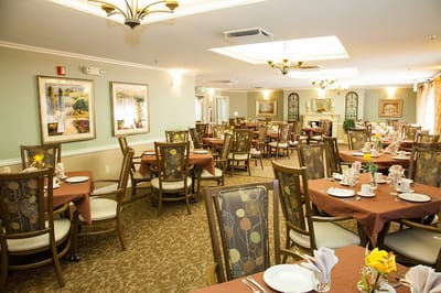 Dining room with tables set for meals in a warm atmosphere