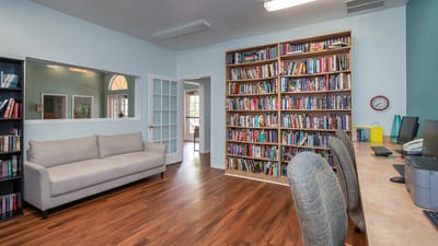 Interior view of a cozy reading area with bookshelves