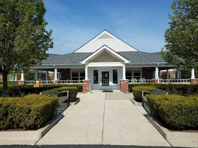 Exterior view of Medilodge of Monroe with landscaping