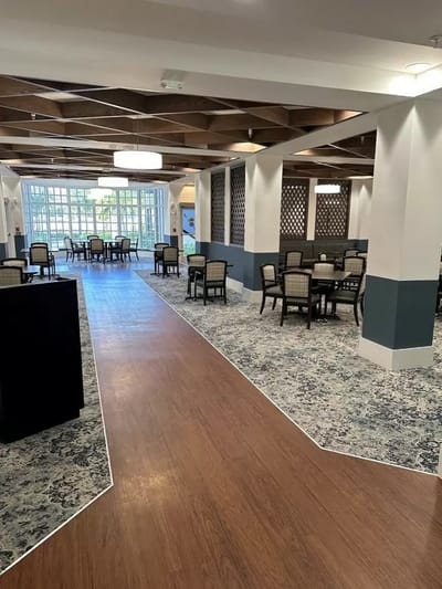 Interior view of a dining area with tables and chairs