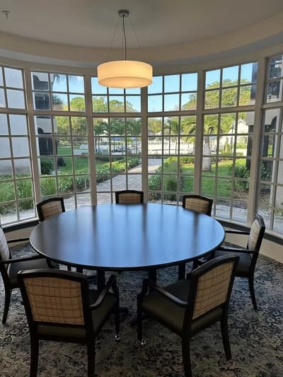 Interior view of a bright common area with a round table