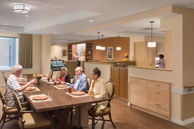 Residents enjoying a meal together in a dining room
