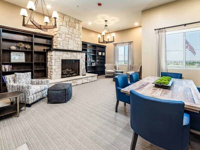 Cozy common area with a fireplace and seating
