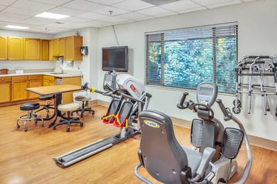 Interior view of a physical therapy room with equipment