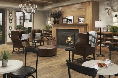 A cozy common area with seating and a fireplace