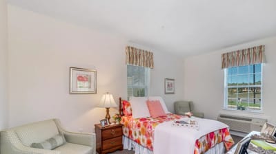 Cozy private resident room with floral bedding